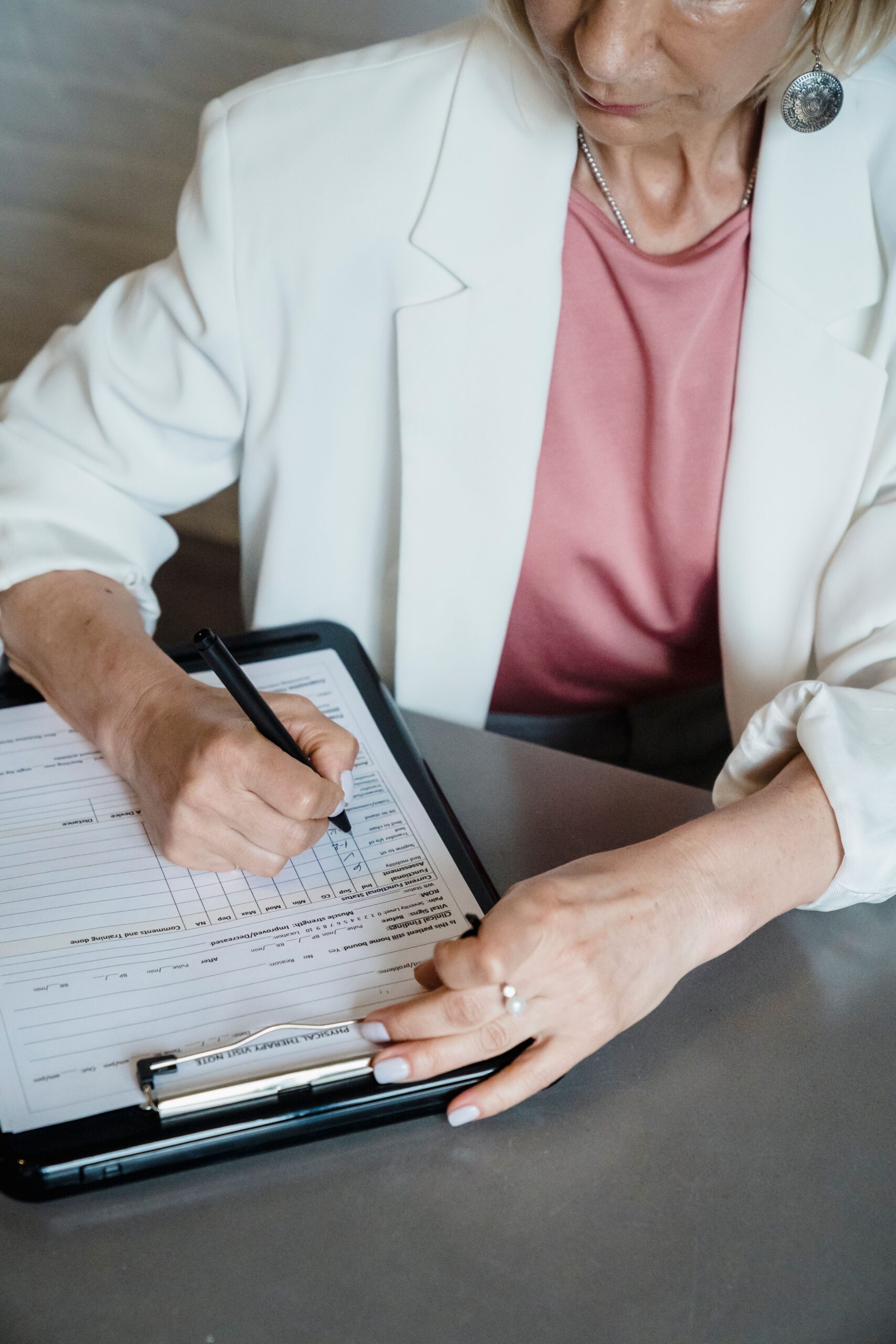 Elmes carer completing a home care plan and risk assessment